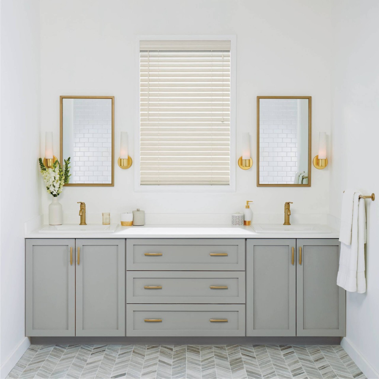 Bright white modern bathroom with a central window covered by Hunter Douglas EverWood® Alternative Wood Blinds near Costa Mesa, CA