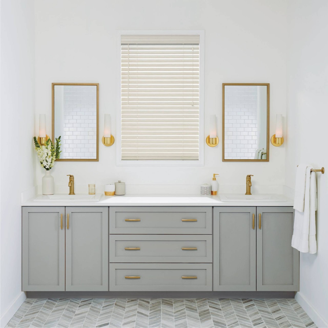 Bright white modern bathroom with a central window covered by Hunter Douglas EverWood® Alternative Wood Blinds at Creative Window Designs near Costa Mesa, CA