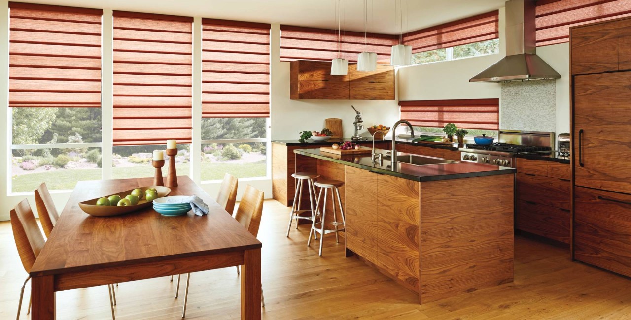 Kitchen with many wooden features and Hunter Douglas Vignette® Roman Shades on the windows near Costa Mesa, CA